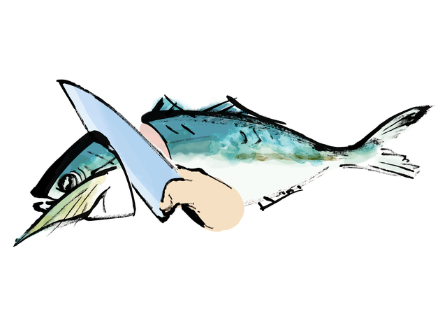 魚の頭を切り落としている画像